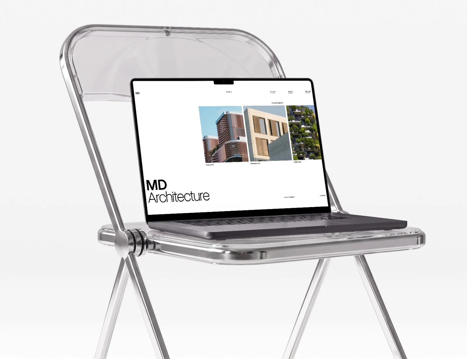 Laptop resting on a transparent folding chair, displaying a modern digital portfolio website for MD Architecture with a gallery of project thumbnails.